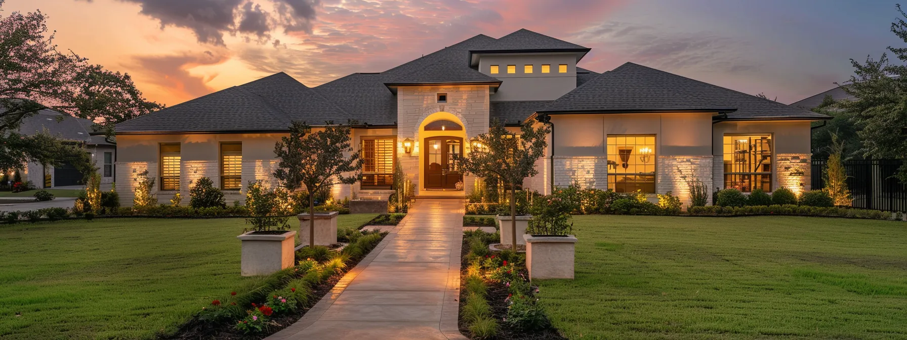 a modern suburban home at dusk, featuring warm exterior lighting and a well-maintained lawn, stands resilient against a slightly cloudy sky, symbolizing the vital importance of reliable backup power during potential storms.